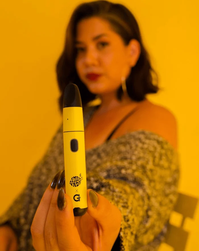 Holding the Lemonnade x G Pen Micro+ toward the camera