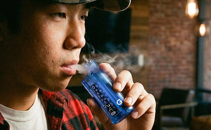 Blue Translucent G Pen Hydout held to the lips
