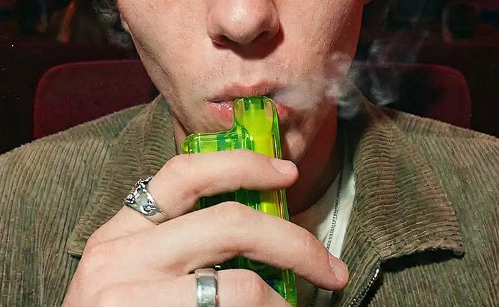 Neon Green Translucent G Pen Hydout held to the lips