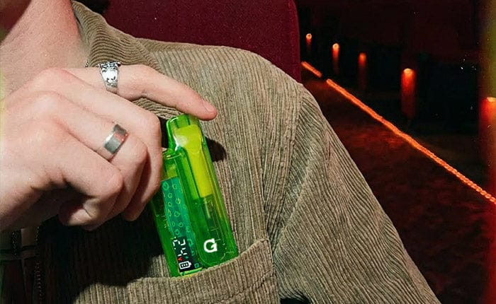 Putting the Neon Green Translucent G Pen Hydout into a pocket
