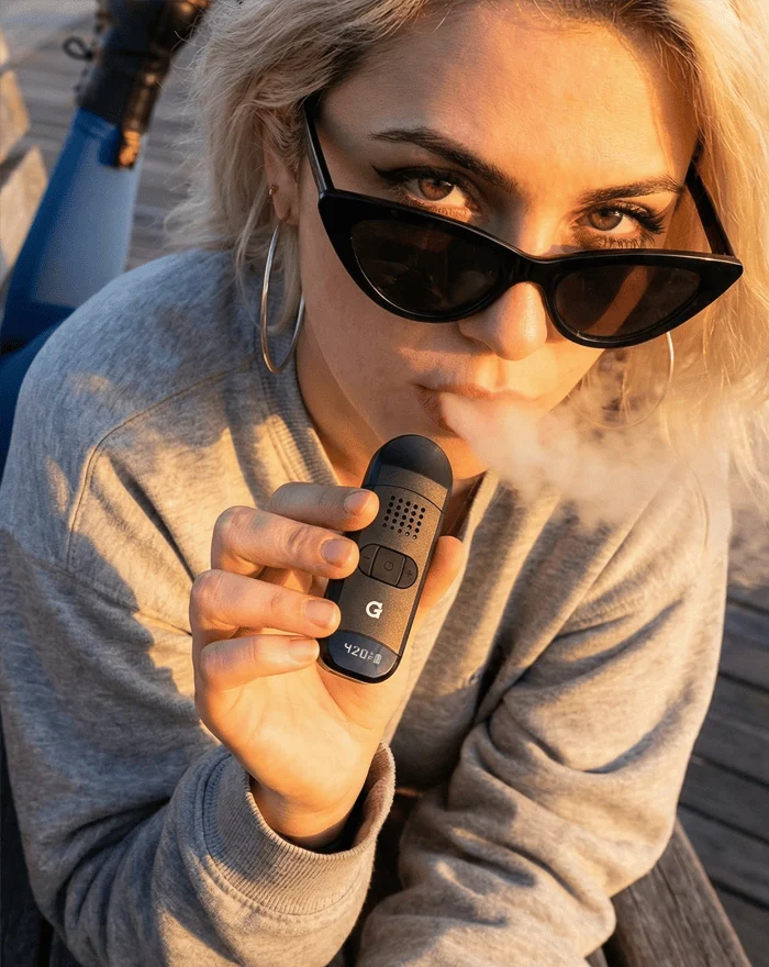 G Pen Dash II dry herb vaporizer in use