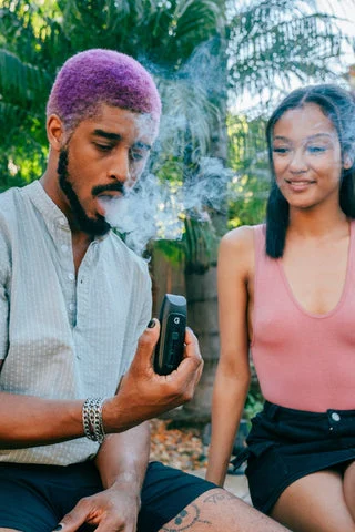 Guy and Girl Using a Dry Herb Vaporizer