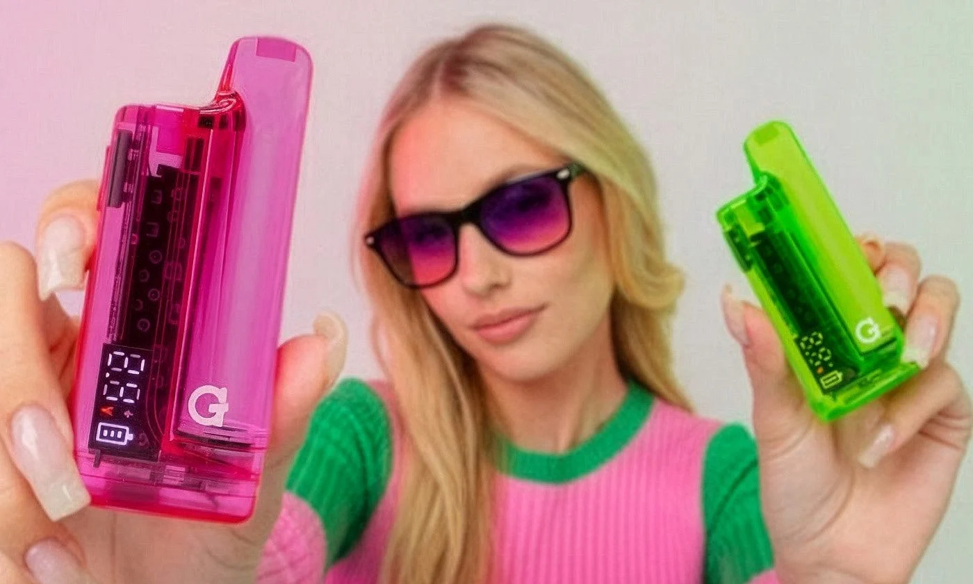 Flat lay of all five G Pen HYDOUT Retro batteries in neon green purple pink blue and red translucent colors arranged in a ...